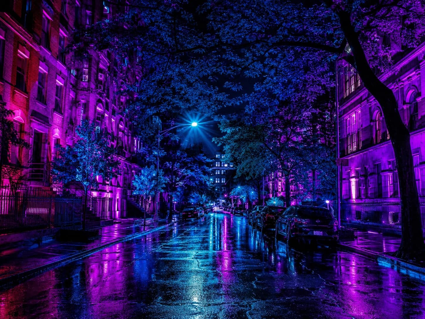 A real city street with no added objects, its every surface transformed into magenta, violet and cyan light
