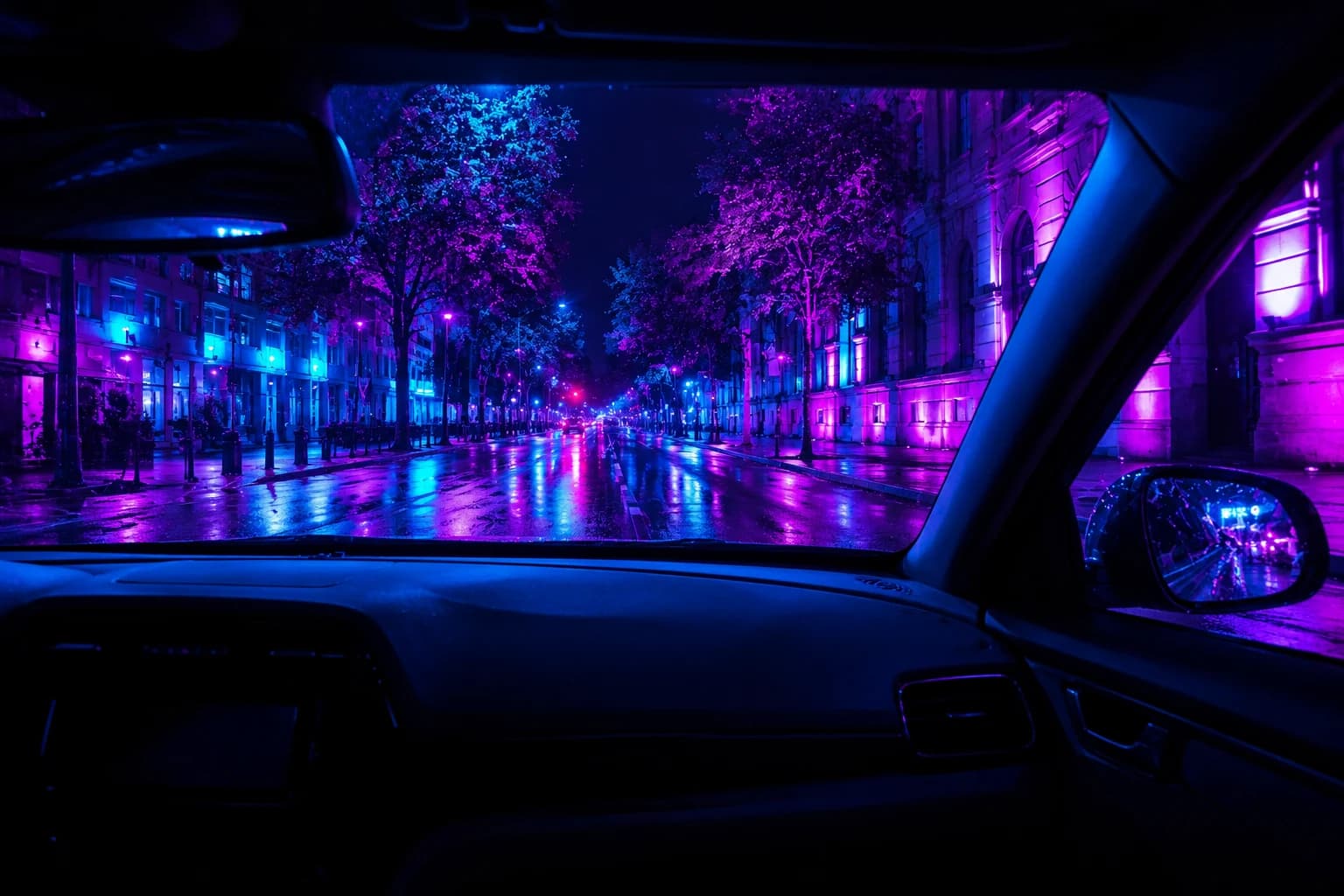 The view from a parked car at night onto a street transformed by spectral colour